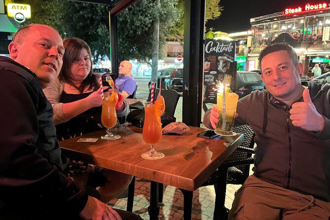 Albufeira PRIVATE Night Tour with Cocktails & Drinks - Praia da Oura stop: shifting from historic streets to a beach-strip vibe