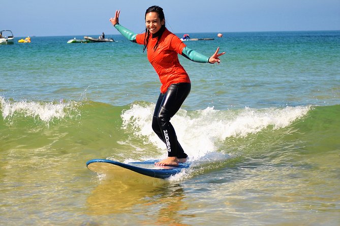 Albufeira: Surf Lesson - The wood kiosk meet-up, gear handoff, and the simple rules