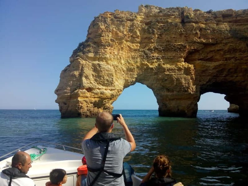 Armação de Pêra: Benagil and 10 Best Caves Guided Boat Tour - Aurora Boat Trips departure, safety gear, and that first coast view