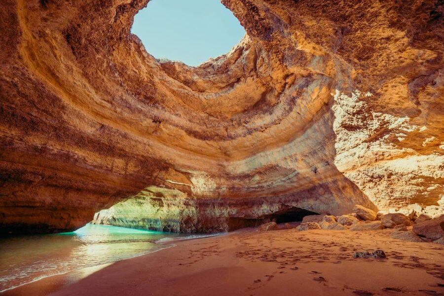 Benagil: Caves, Coves & Secret Beaches Guided Kayaking Tour - Entering the Benagil Sea Cave: multicolored rock, sun beams, and photo moments