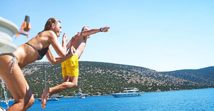 Boat Party to the Beach with Swimming Stops, DJ and Open Bar - Who Should Book This (and Who Should Skip It)