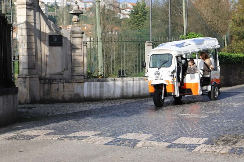 Coimbra: TukTuk Adventure. Local and multilingual host. Hotel pickup. - Finding the white and orange tuktuk at Largo da Portagem