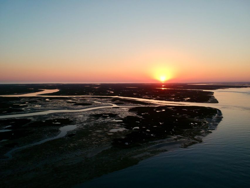 Faro: Ria Formosa Sunset Nature Boat Tour - The First Stop: Faro photo stop and the calm cruise setup