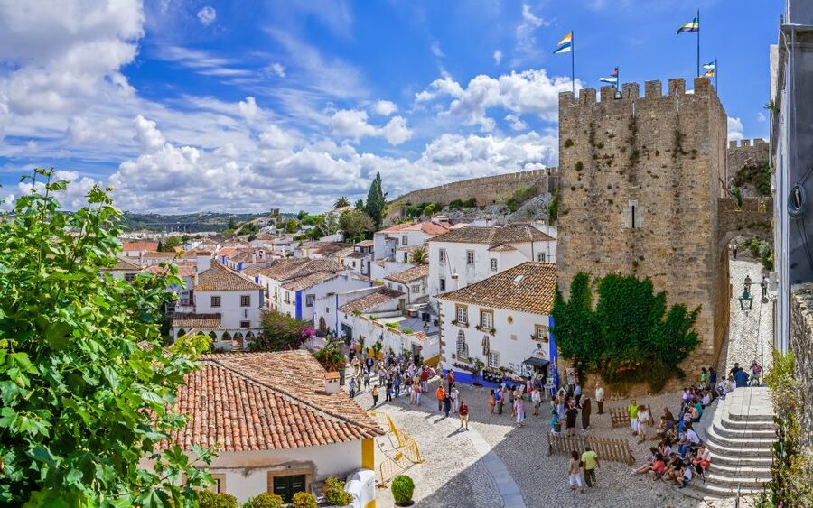 From Lisbon: Fatima, Nazare, and Obidos 8-People Group Tour - Óbidos old town walls: medieval streets, 1148 origins, and ginjinha in chocolate