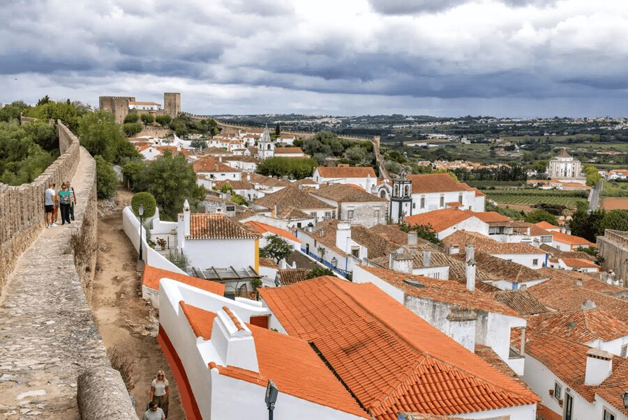From Lisbon: Nazare Big Waves & Óbidos Small Group Tour - The Nazaré Waterfront: Fishing Heritage and Easy Time for Seafood