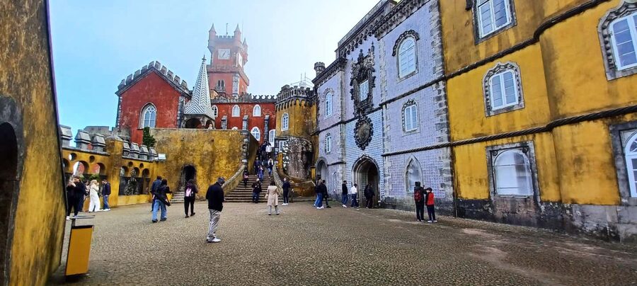 From Lisbon: Tour to Pena Palace, Sintra, and Cascais - Lisbon Pickup, the Air-Conditioned Van, and How the Day Flows