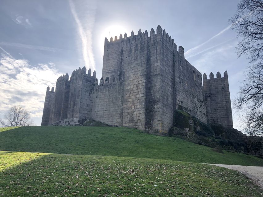 From Porto: Braga & Guimarães with Lunch Small Group Tour - Guimarães Castle: medieval walking, then Portugal’s birth story