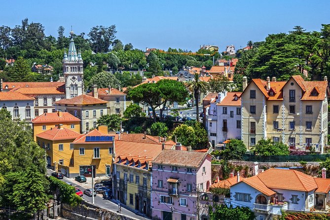 Full-Day Private Sintra Tour with Wine Tasting and Pena Palace - Dunes and Cascais: surf scenery, then a charming coastal town