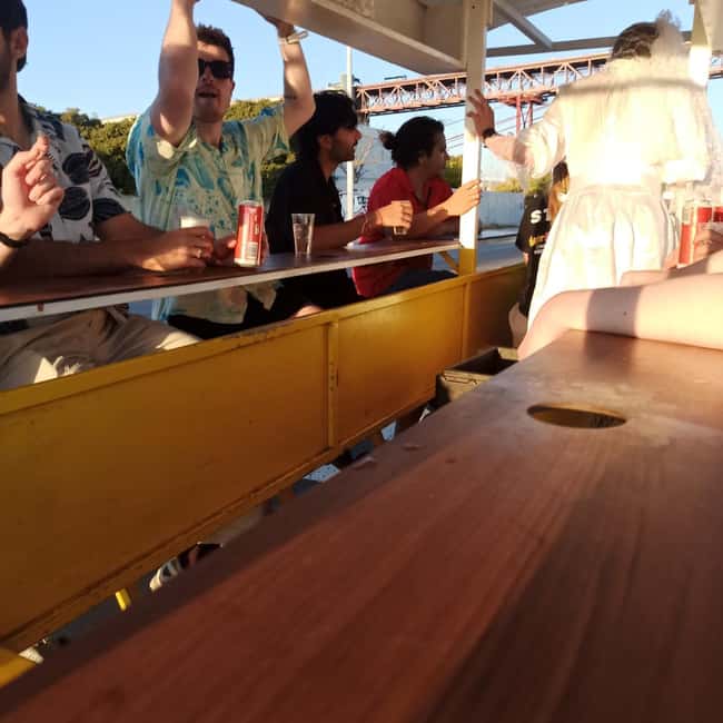 Lisbon: 1-Hour Beer, Sangria or Wine Bike Sightseeing Tour - The 25 de Abril Bridge Segment, Photos and Sunset Energy