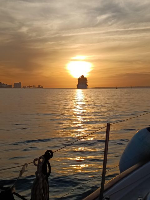 Lisbon: 2H Sunset Boat Cruise Tour with Drinks - Passing the 25th of April Bridge: the view that turns into a photo magnet