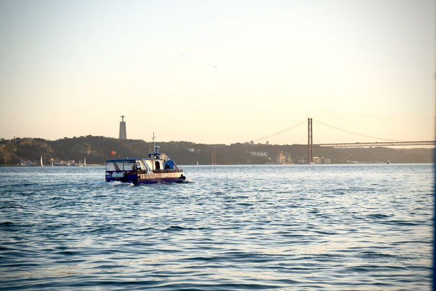 Lisbon: Boat Cruise with Live Fado Performance and a Drink - Small-boat reality: views, wind, and photography