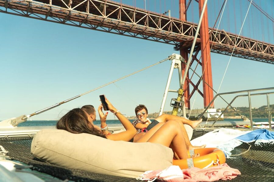 Lisbon: Catamaran Boat Party with Music, Open Bar & Dives - Party on the Tagus: why this feels different in Lisbon