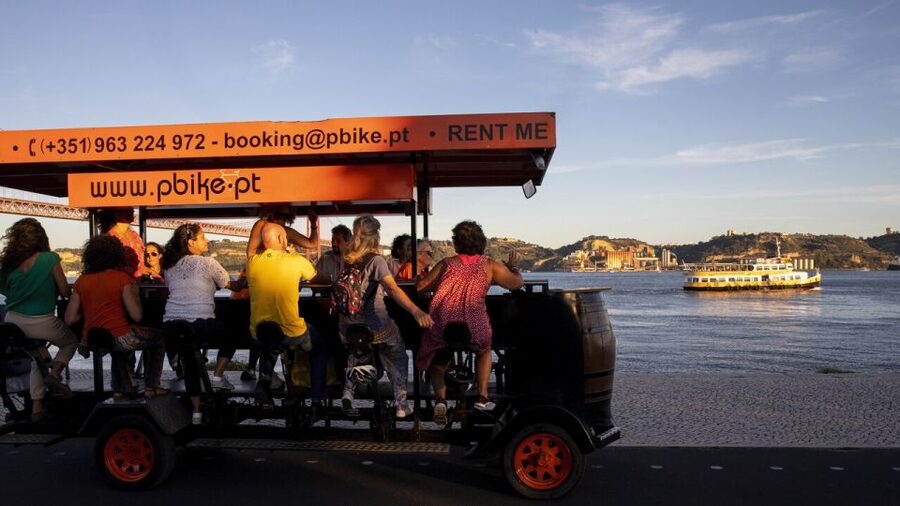 Lisbon: Fun Beer Bike by the Seafront - Entering the Experience at the MOTAO Seafront Meeting Point