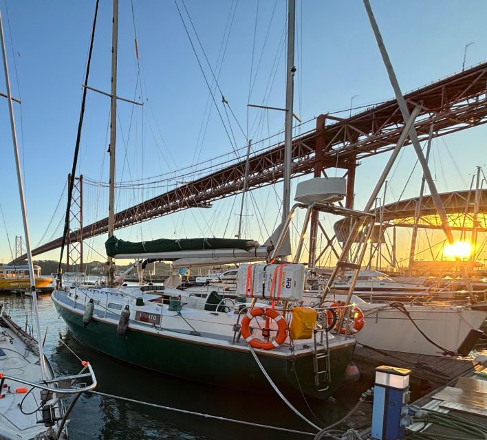 Lisbon: Private Sailing City & Sunset Tour - Passing under the 25 de Abril Bridge and the story behind it