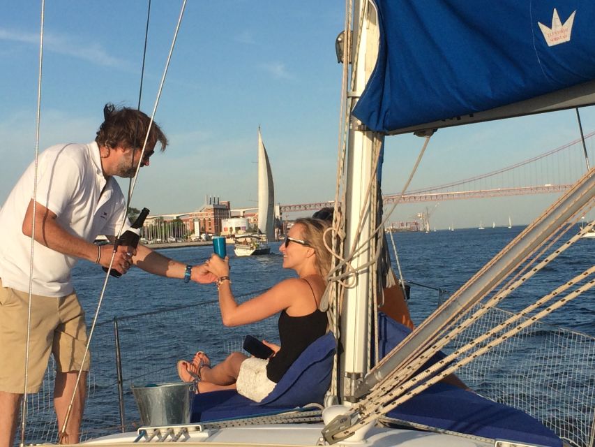Lisbon: Private Sunset Sailing Tour with Champagne - On board: welcome drinks, champagne, and that romance-ready setup