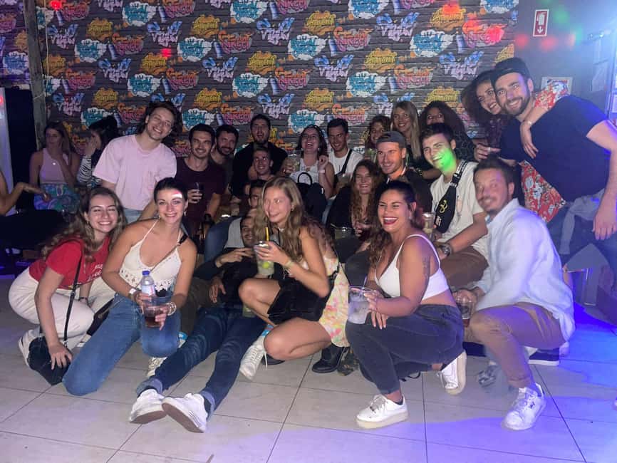 Lisbon: Pub Crawl with Open Bar (Premium Upgrade Available) - Pink Street at night: sightseeing without the boring parts