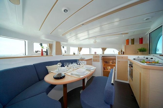 Lisbon Sailing Catamaran Public Cruise with drinks - Onboard vibe: small group, calm music, and drinks that help the pace