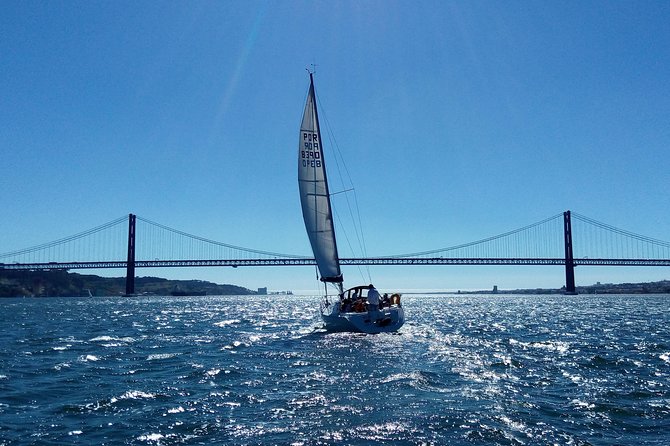 Lisbon Sailing Tour on a Luxury Sailing Yacht with 2 Drinks - The midway break: two drinks and Portuguese cheese and chouriço