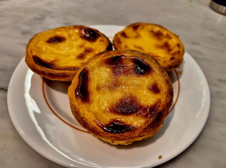 Lisbon Small-Group Food & Wine Tour Eat & Drink like a Local - Ginjinha and Chouriço Assado with Red Wine