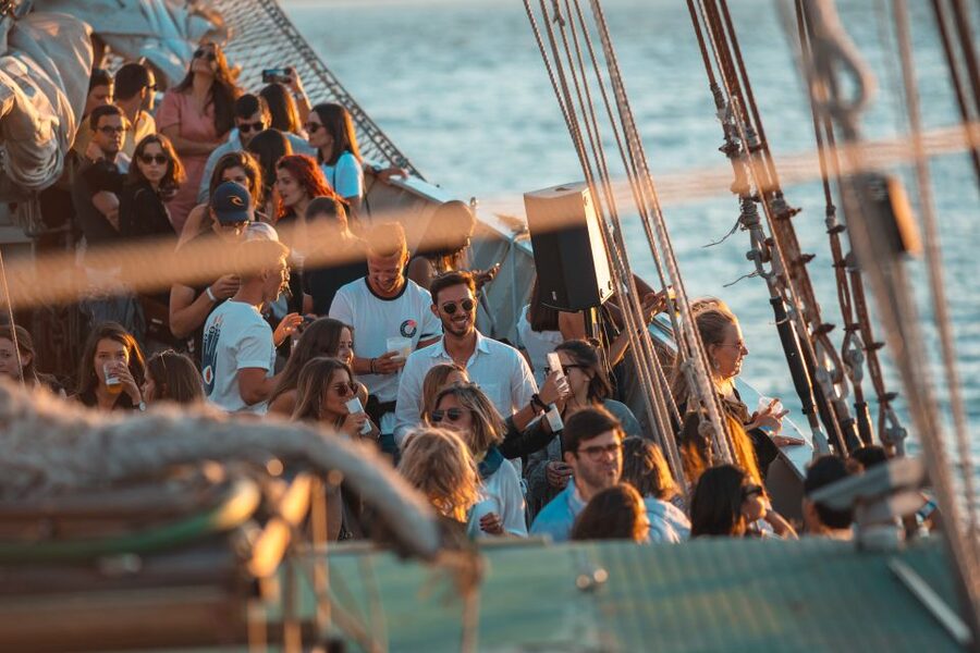 Lisbon: Sunset Boat Party Cruise with Music & Drinks - Christ the King from the river, the golden-hour payoff