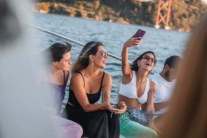 Lisbon : Sunset Catamaran Boat Tour with Music and Drinks - Belém from the water: Tower of Belém and fort-like defense vibes