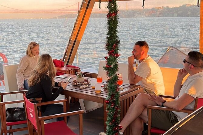 Lisbon : Sunset Catamaran Boat Tour with Music and Drinks - The Discoveries monument: a caravel shape with names you can picture