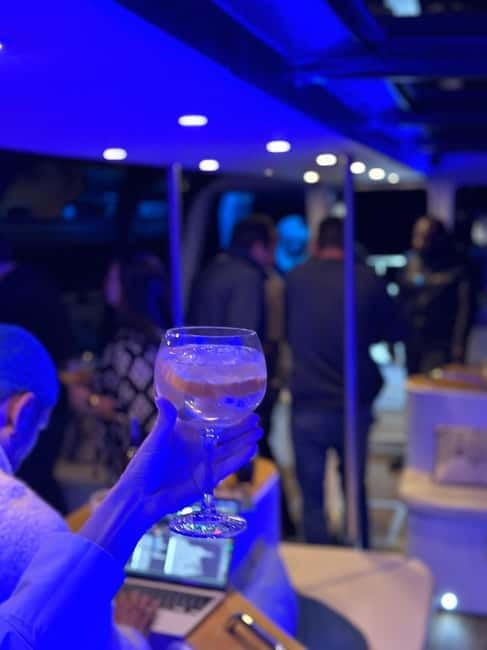 Lisbon: Sunset DJ & Porto Tonic Premium Boat Experience - Praça do Comércio when the lights come on: where the cruise feels like nightlife