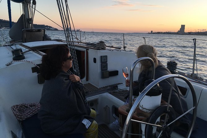 Lisbon Sunset Sailing Tour with White or Rosé Wine and Snacks - On board: sailboat size, seating, bathrooms, and the wine snack reality