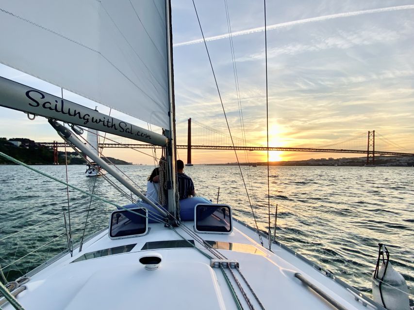 Lisbon: Tagus River Sunset Cruise with Drinks - Passing Commerce Square and cruising into Alfama’s evening character