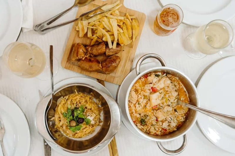 Lisbon: Tastes and Traditions Guided Food Tour - Tasca time: salt cod with alheira and the comfort-meets-history vibe