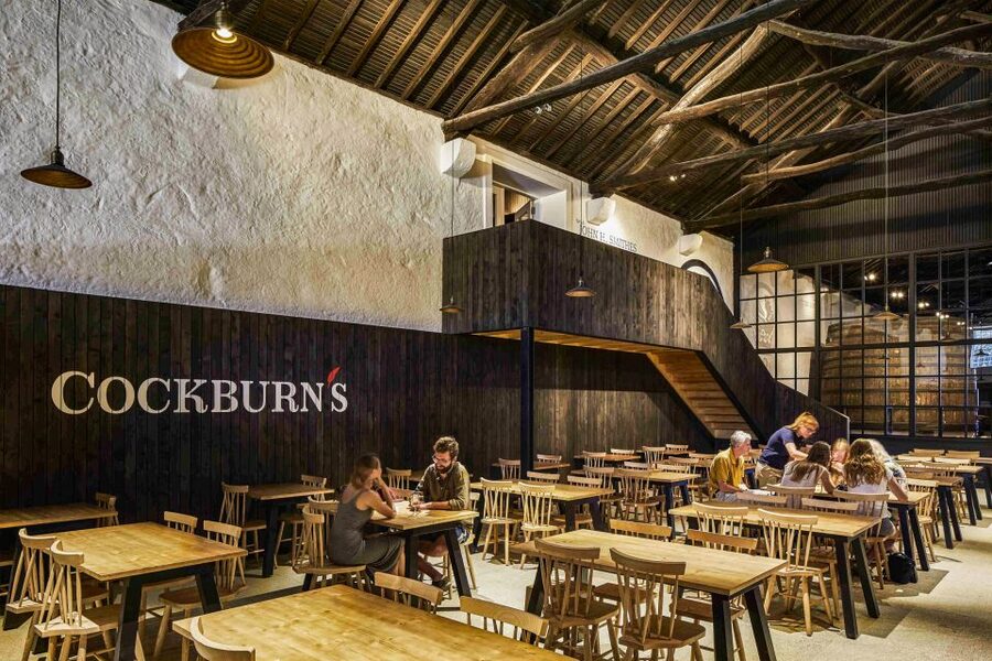 Porto: Cockburn’s Port Lodge Tour and Tasting - Inside the working cellar, where the numbers hit hard