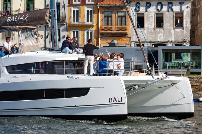 Porto Douro River Cruise With Port Wine - Daytime or Sunset - Clérigos Tower, tram museum area, and the “tiling-on-the-water” effect
