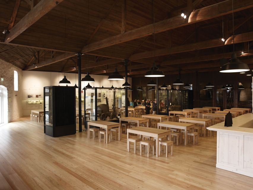 Porto: Graham's Port Lodge Tour with Premium Wine Tastings - The 1890 Port Lodge itself: history you can see in the pipes