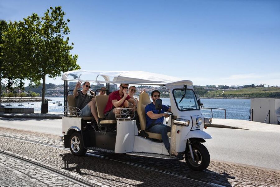 Porto: Private Sightseeing Tour by Electric Tuk Tuk - How the private guide shapes your stops, stories, and photo moments