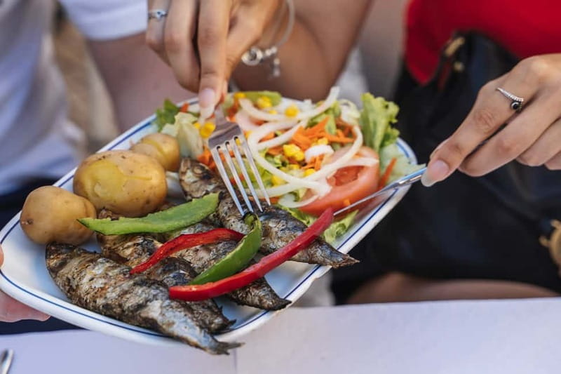Private Lisbon Food Tour in Baixa with Wine & Local Delights - Rua da Madalena: landmarks you remember later